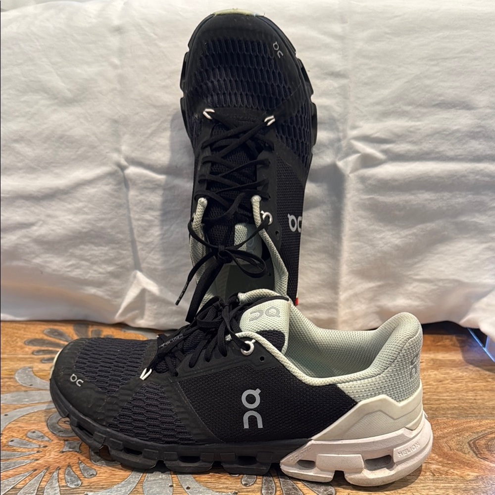 On Running Black and White Athletic Shoes with Cushioned Heel